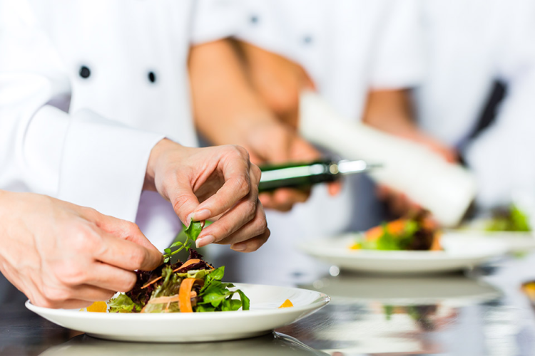 Luxury hotel staff serving guests in 5-star restaurant