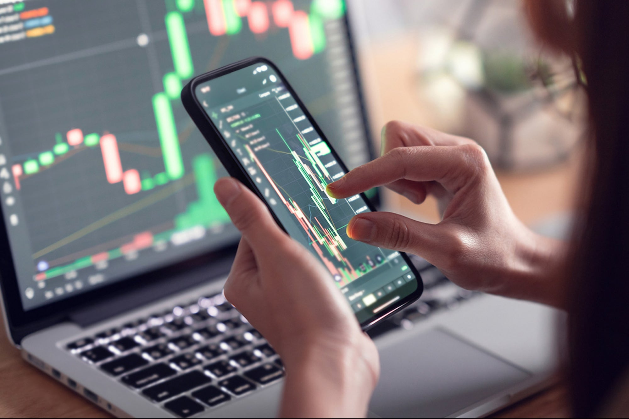 Professional traders analyzing live stock market data on digital screens